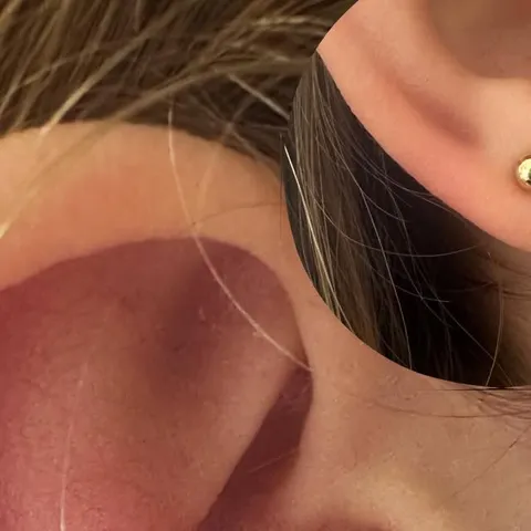 Ear piercing at Polished